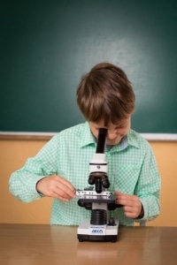 Boy with microscope