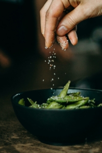 putting salt on peas